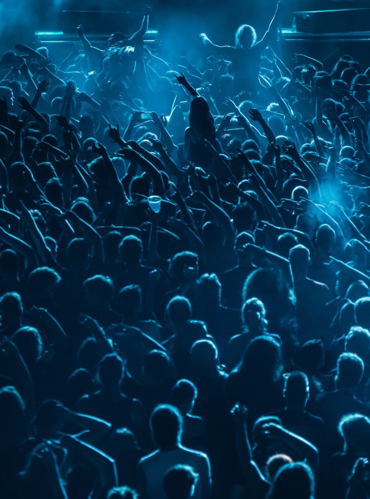 Concert crowd in front of stage lights